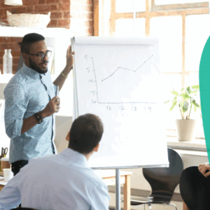 Confident smiling African American business coach speaking to colleagues group at briefing, company meeting, explaining growth of sales graph.